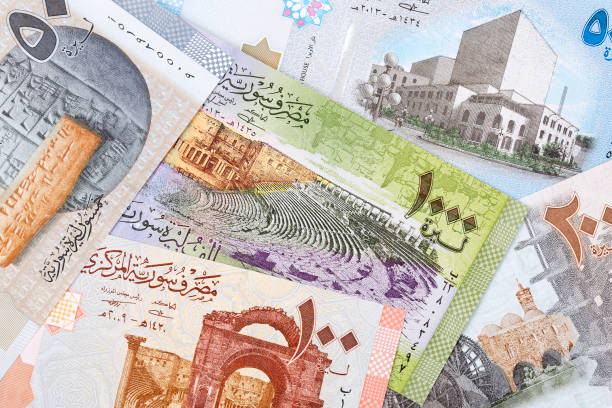 قرار سوري بإعادة تقييم العملة بخفض خانتين من الأصفار كجزء من الإصلاحات الاقتصادية